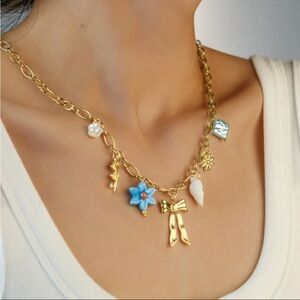 Gold Charm Necklace with Blue and White Accents